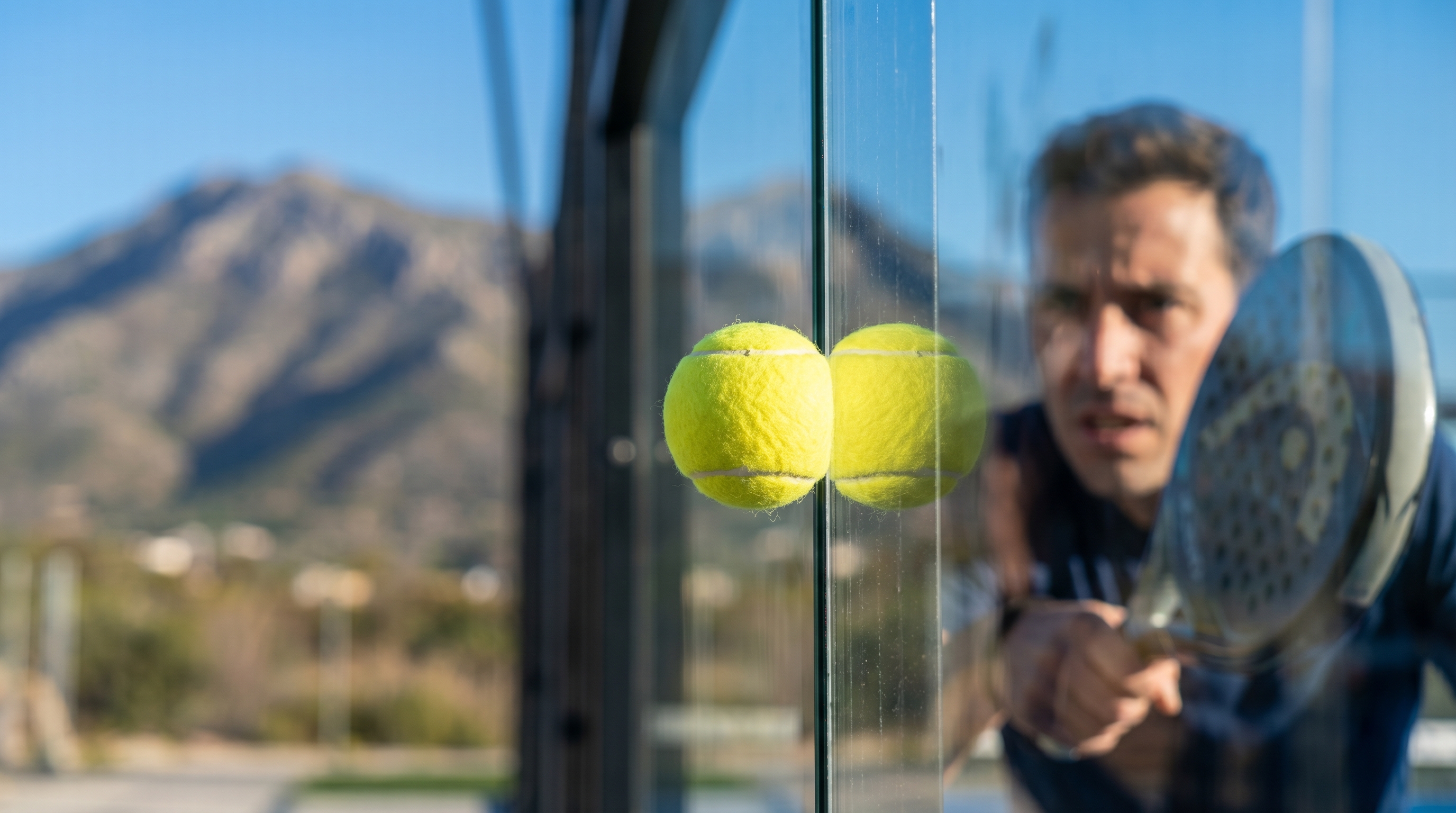 padel ball glass wall rebound