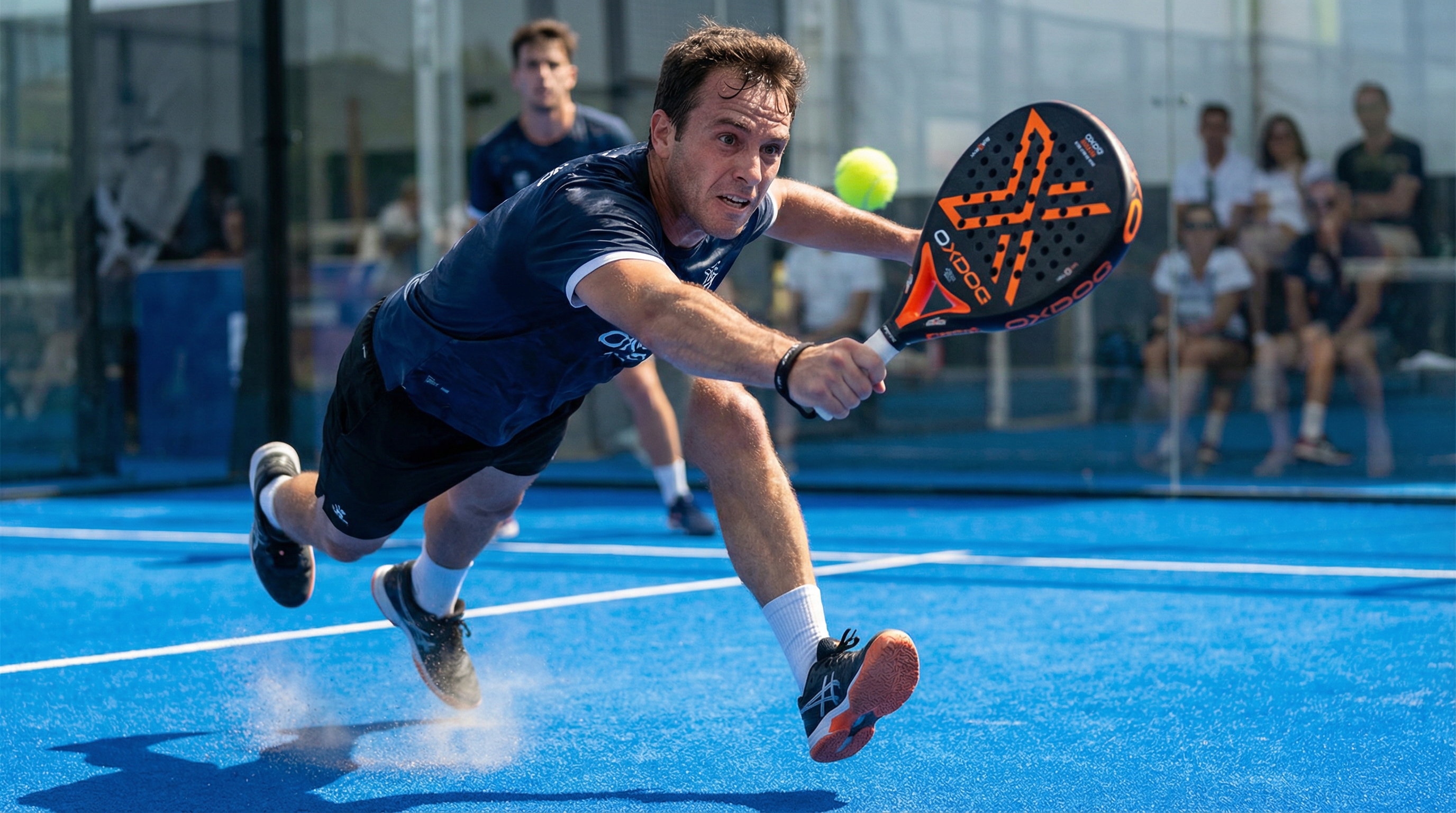Photorealistic image of an intense padel match on a bright blue court, focusing on a player mid-swing with an oxdog padel racket, capturing the motion blur and power.