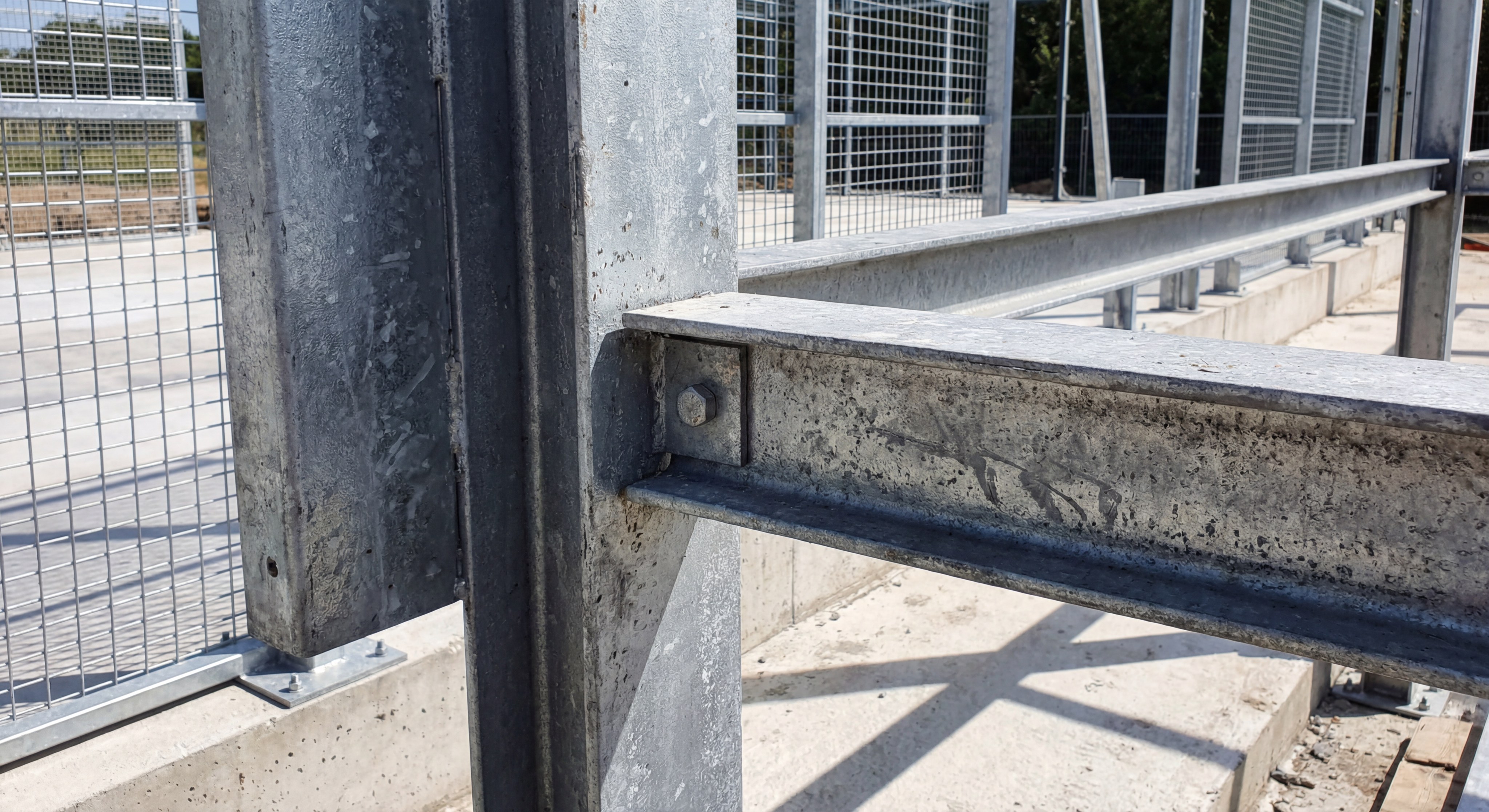 Close-up of hot-dip galvanized steel beams showing anti-corrosion coating