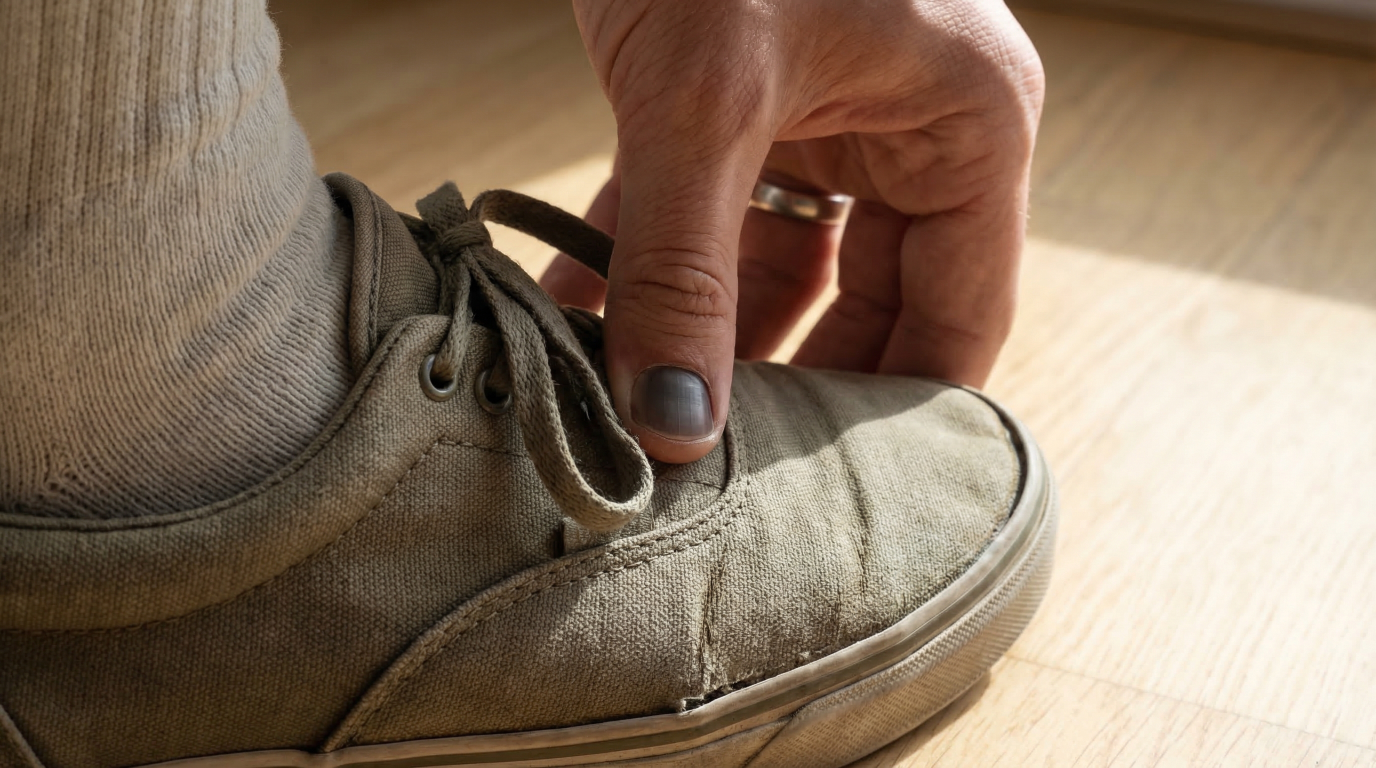 Thumb press test on sneaker toe box