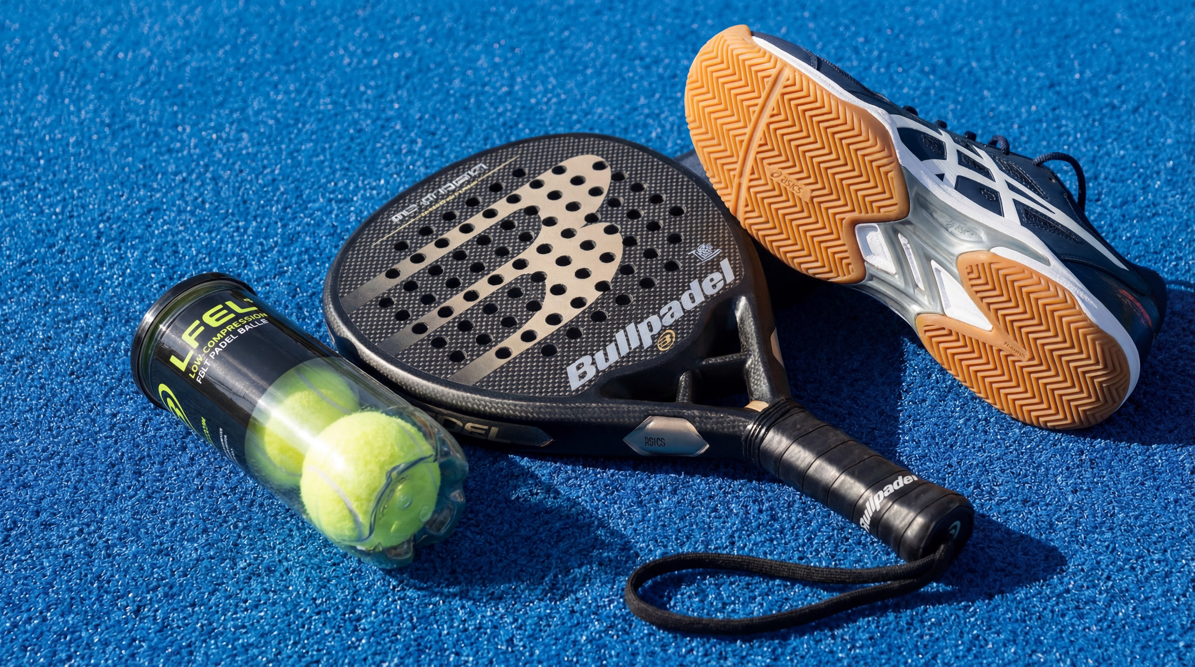 Selection of padel rackets, balls, and specialized shoes