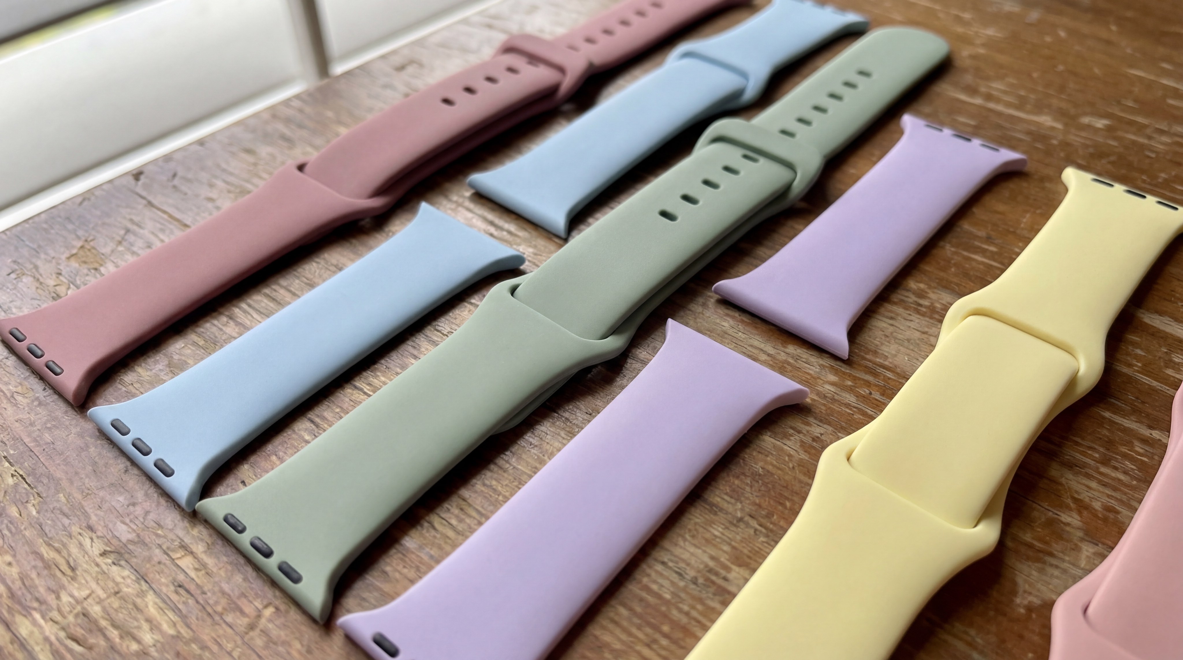 A collection of colorful watch bands made from silicone and other materials.