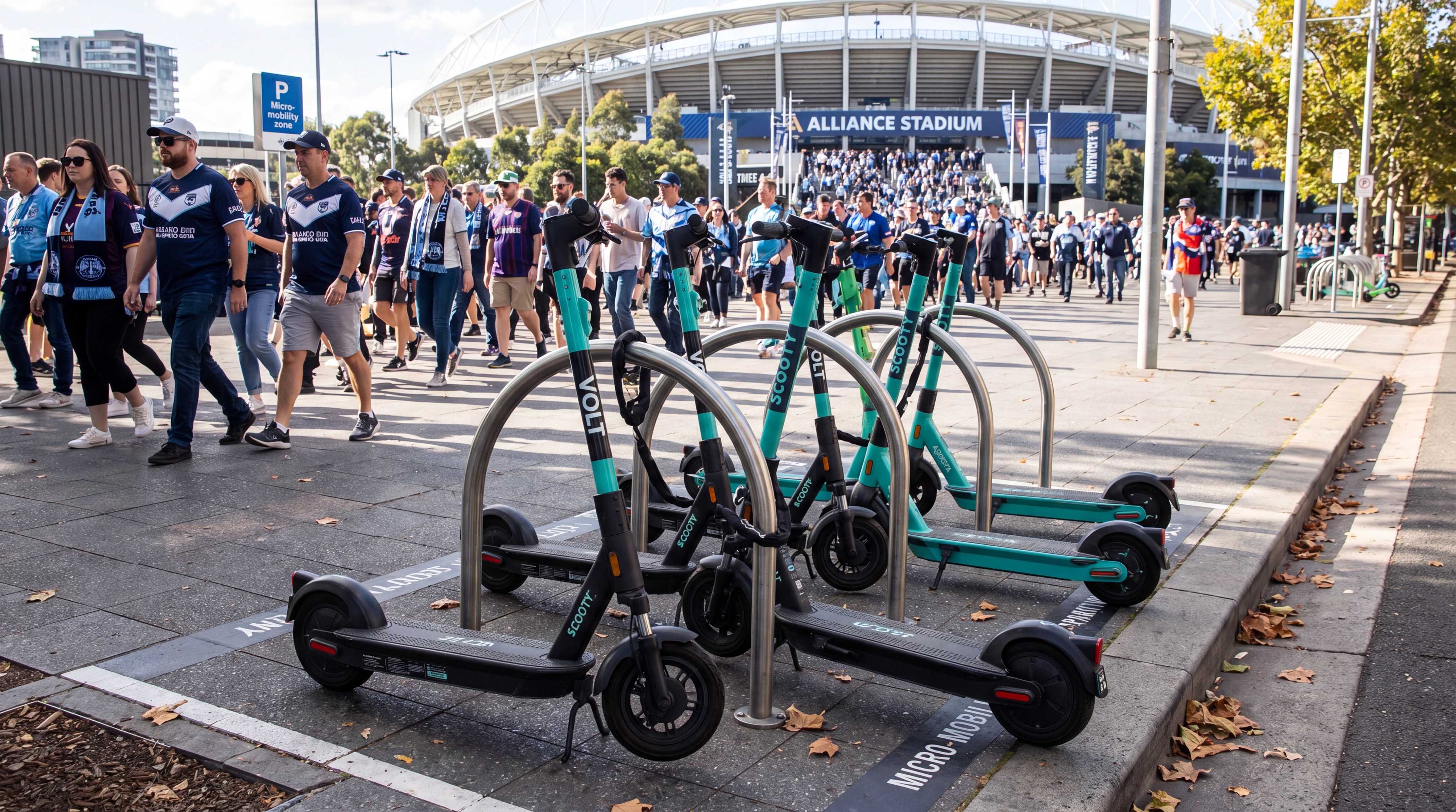 Electric scooters parked at stadium micro-mobility racks
