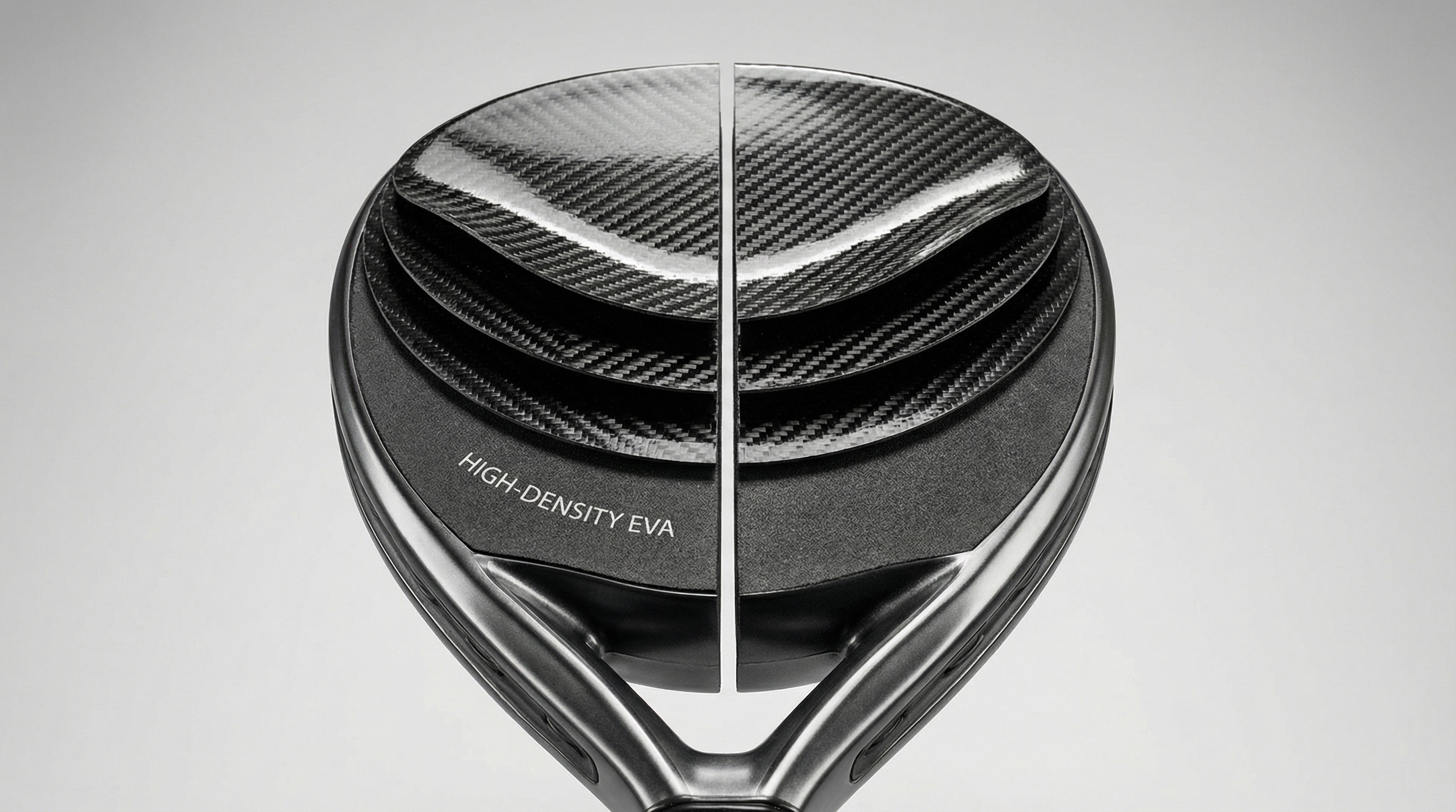 Photorealistic image showing a cross-section of a high-tech padel racket revealing carbon fiber layers