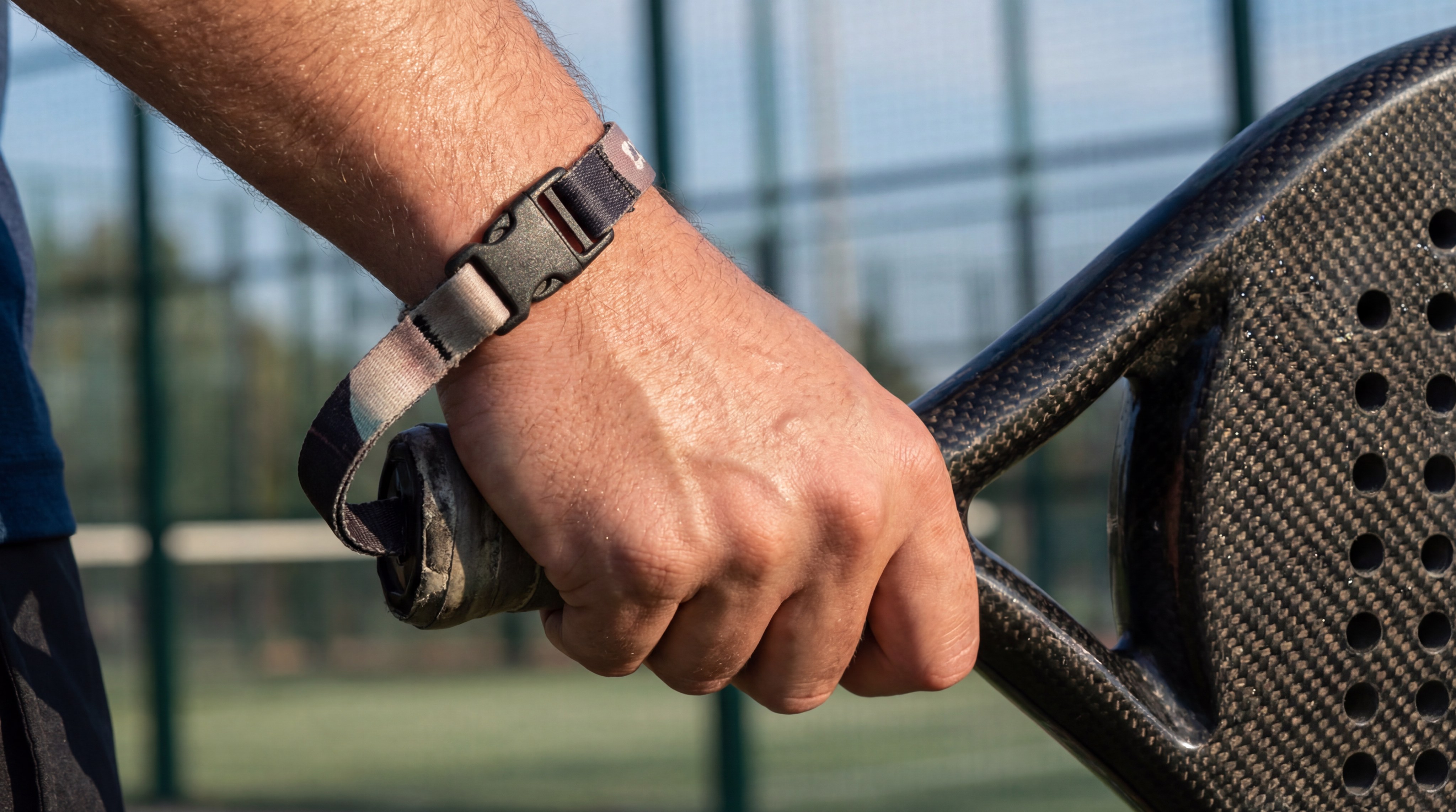 Photorealistic Close-up of Padel Racket Safety Lanyard on Player's Wrist