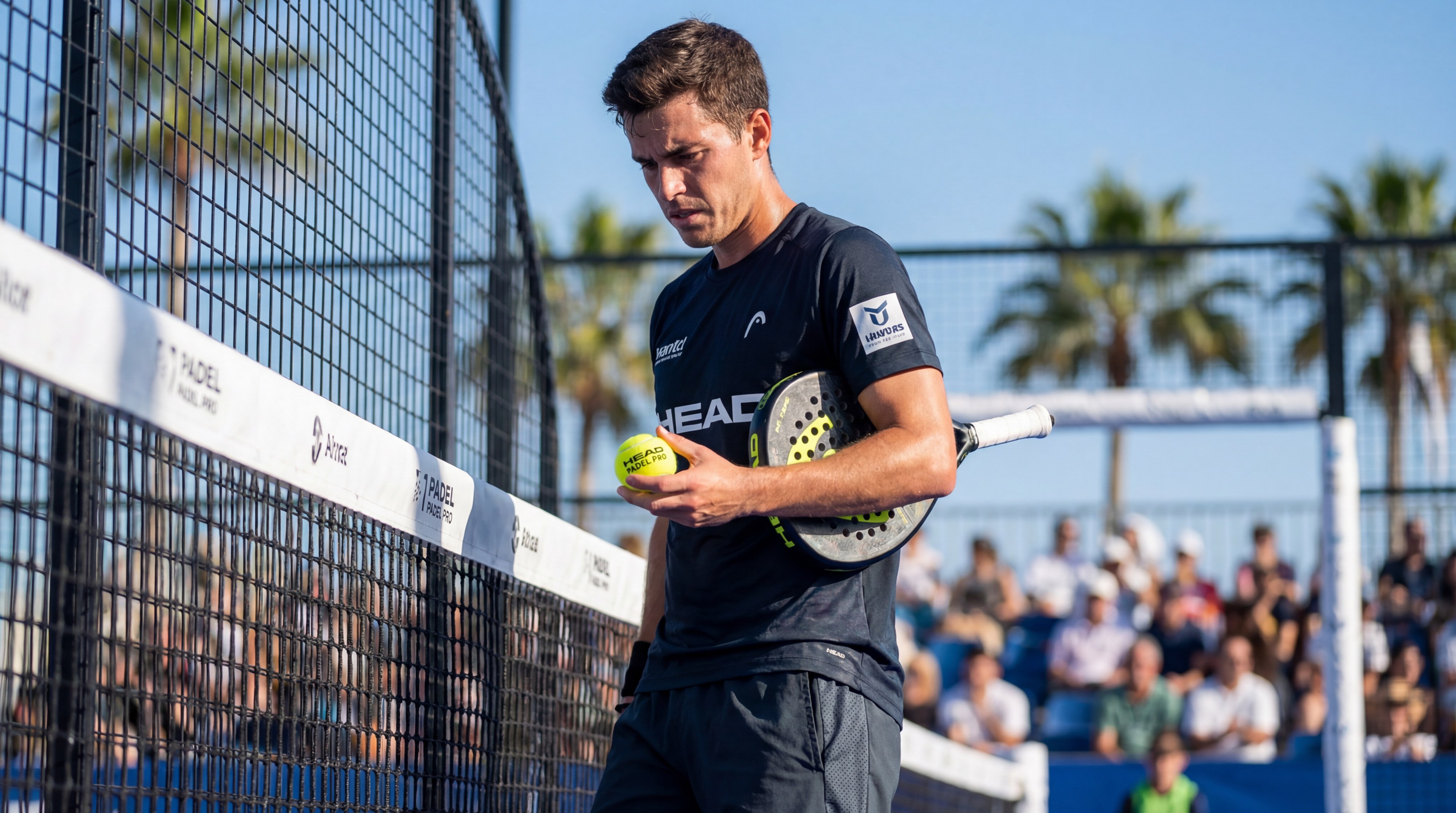 Professional Padel Player Examining Ball