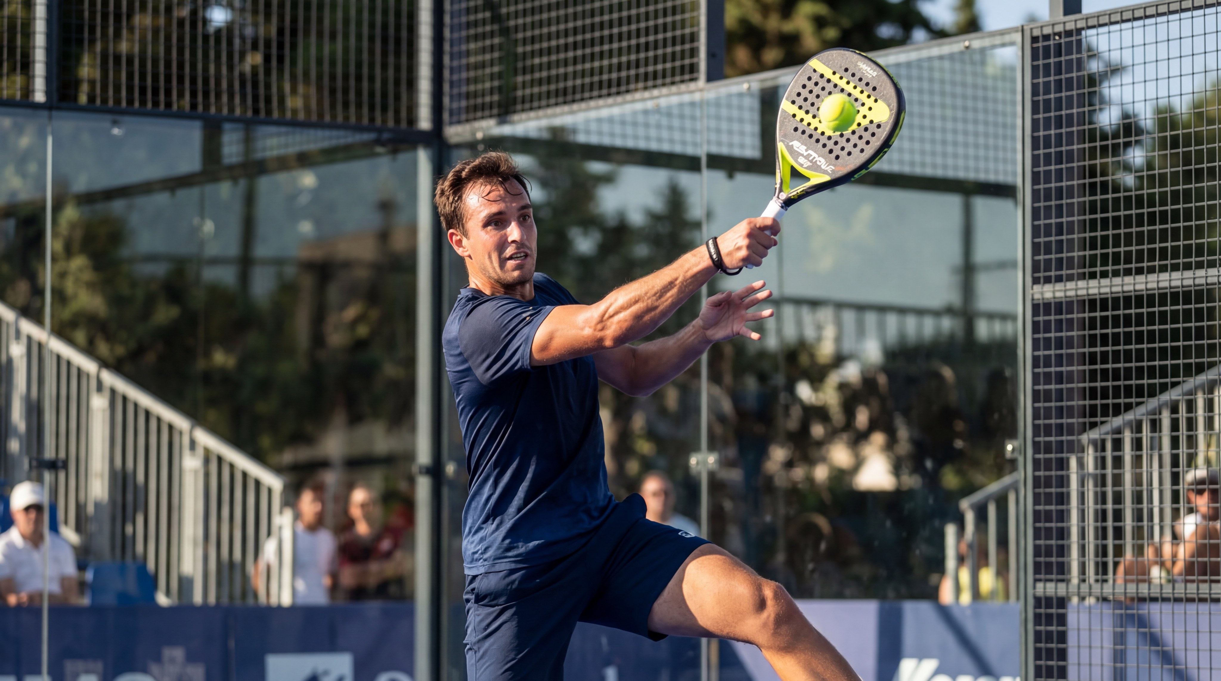 padel player hitting a bandeja shot