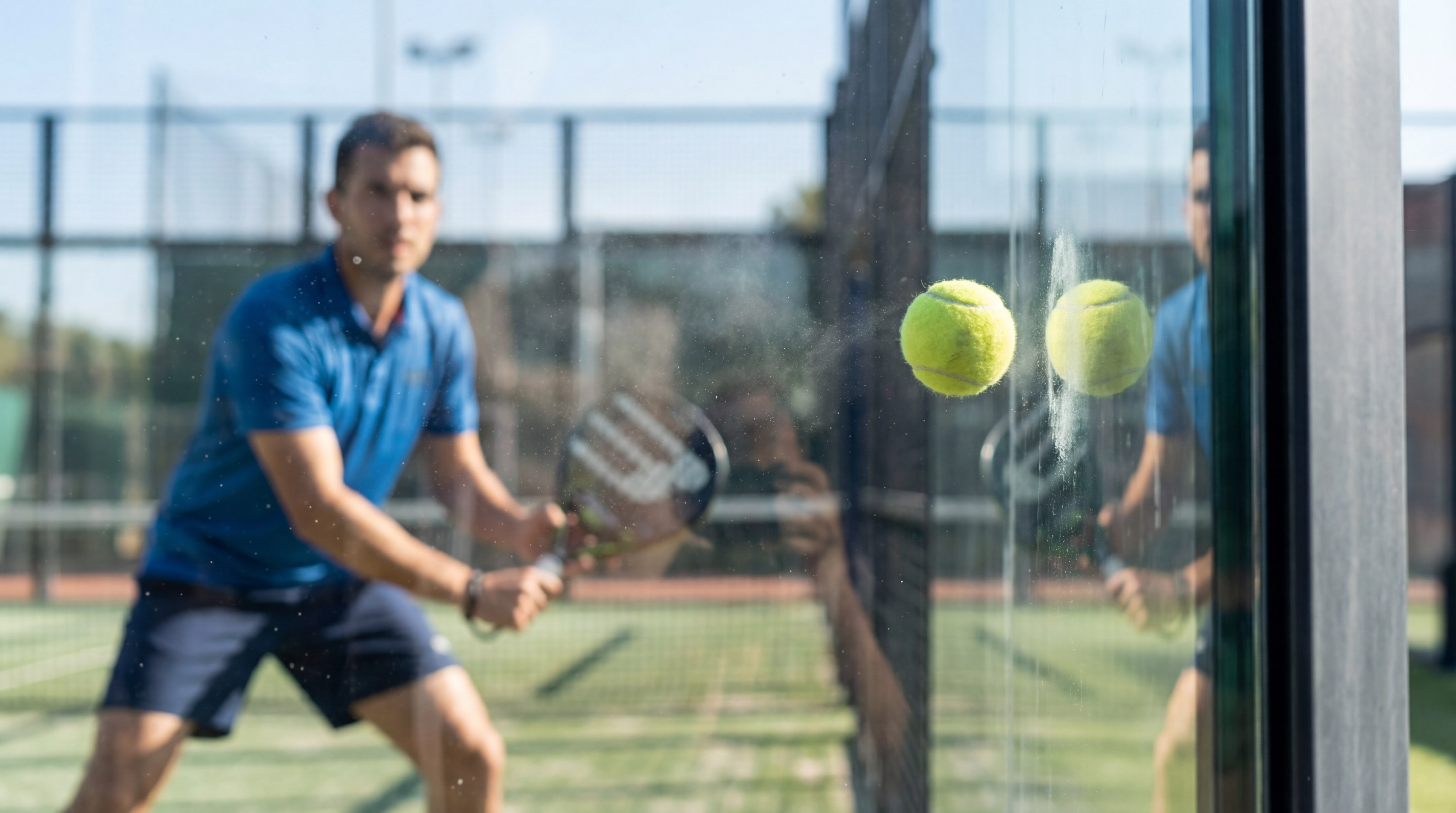 Padel Ball Bouncing Off Glass