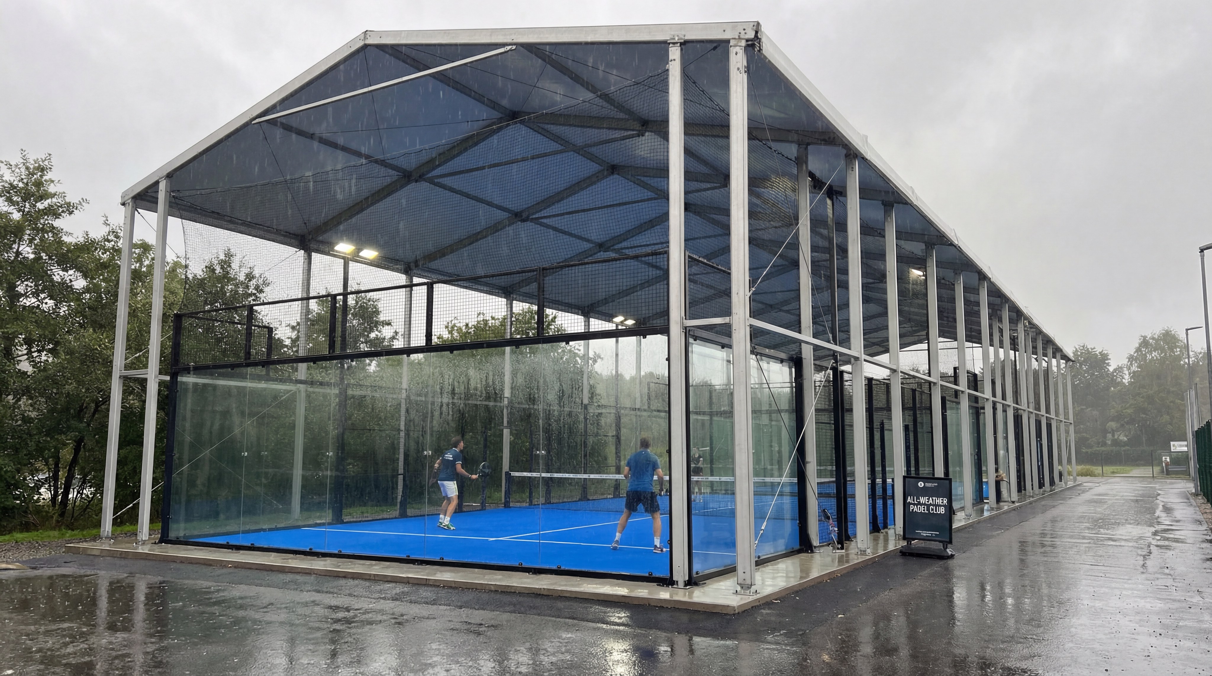 roofed padel court rainstorm