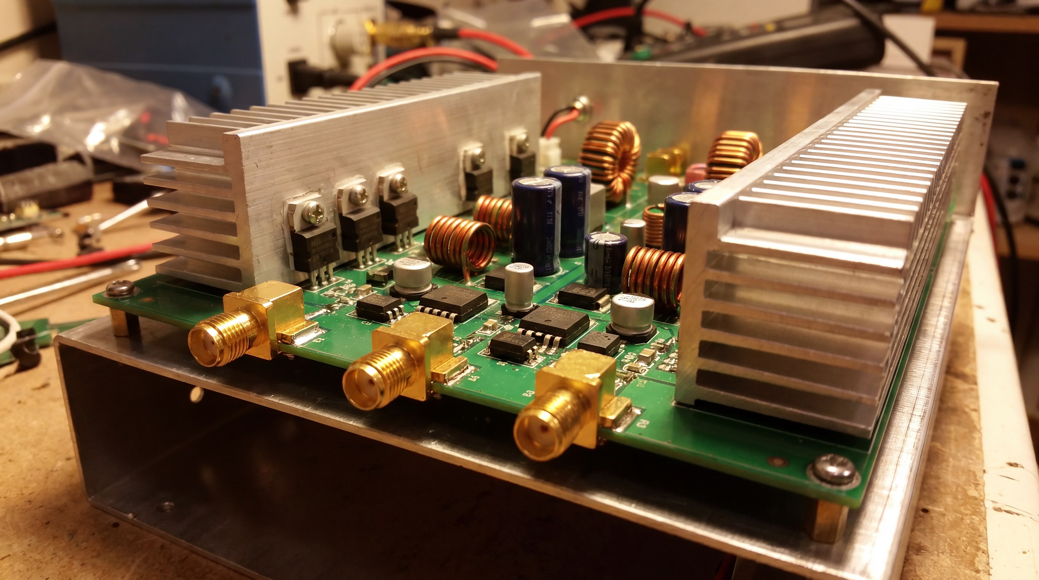 Macro closeup of RF power amplifier components and SMA connectors