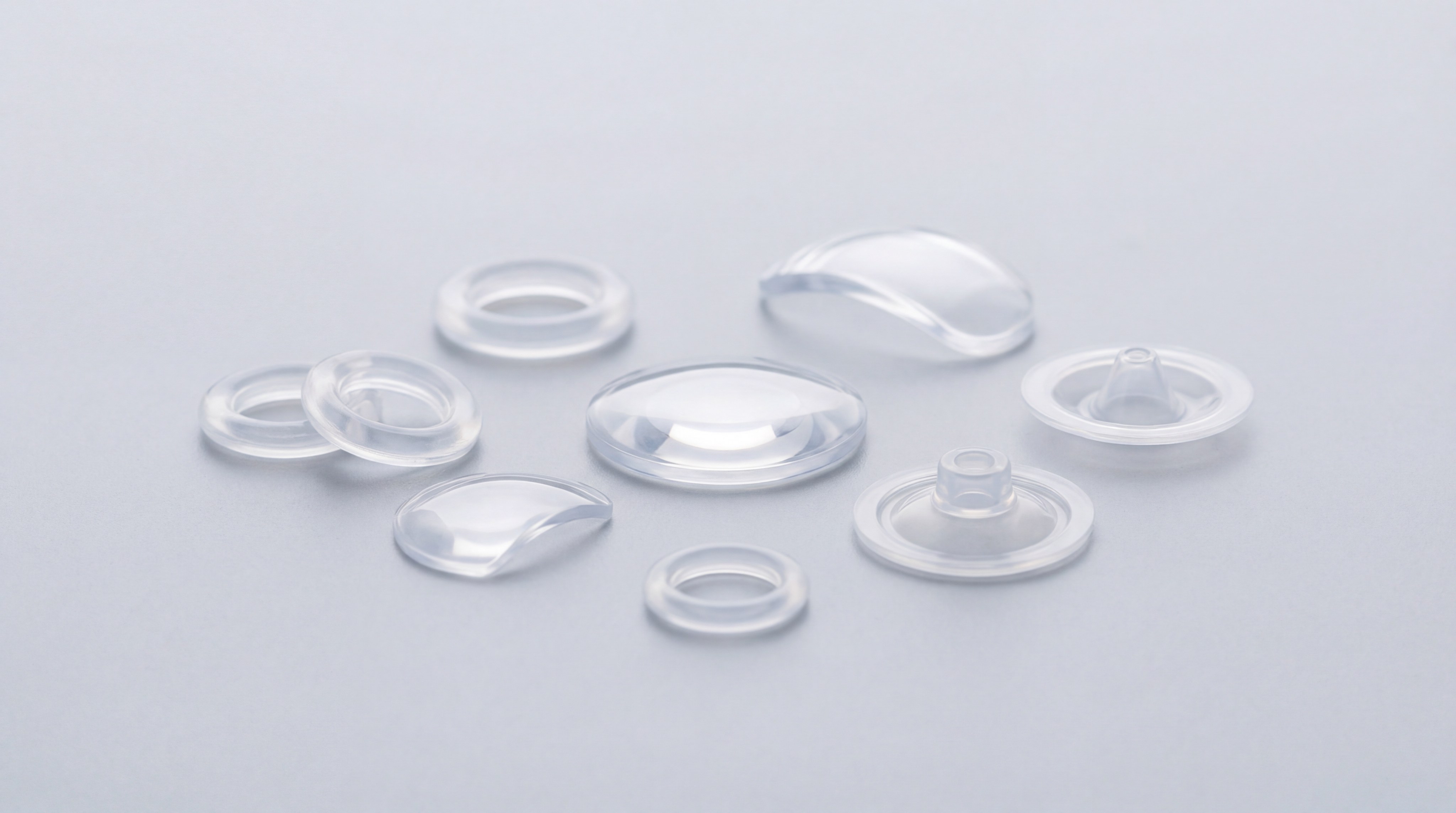 Close-up of optical-grade LSR lenses and medical components