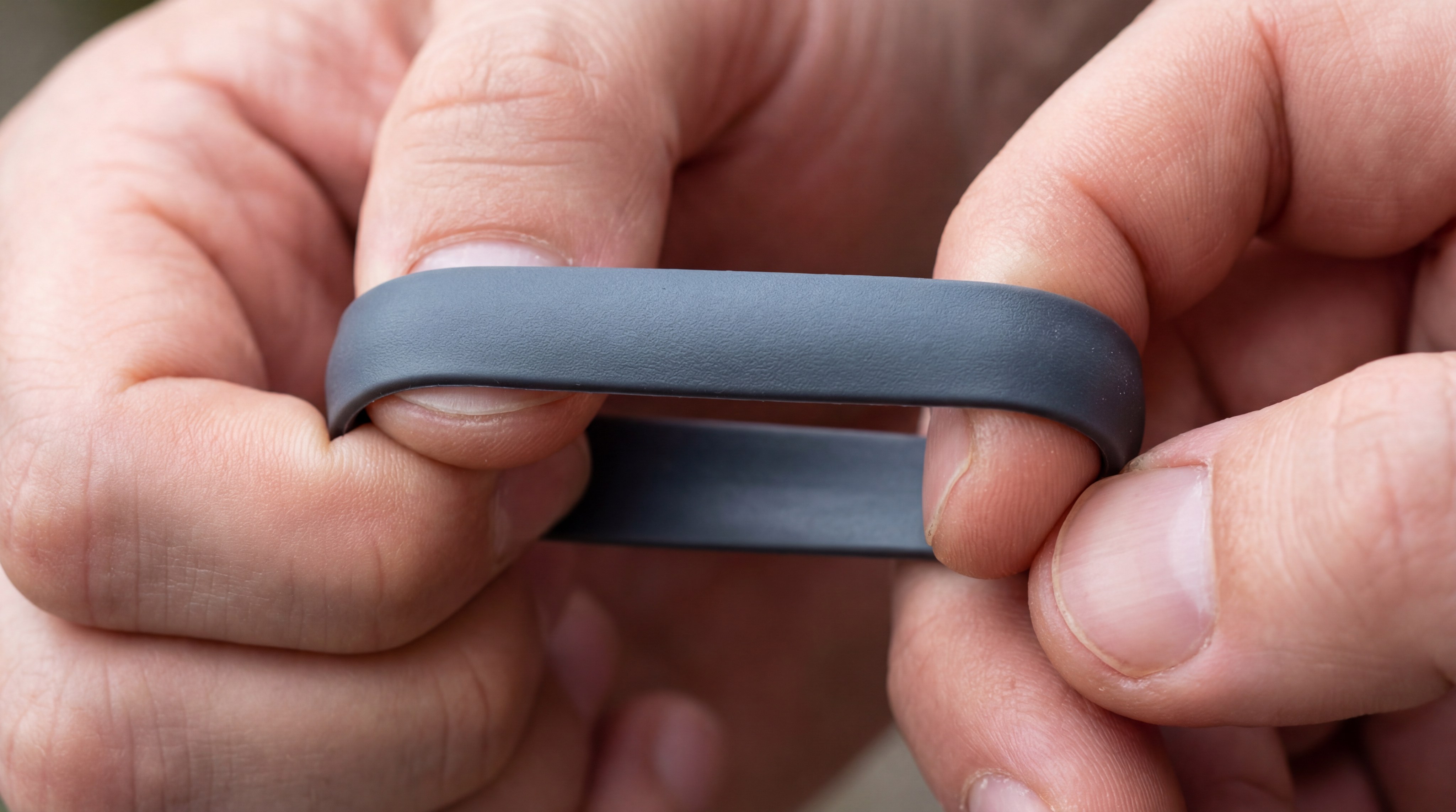 Alt Text: Hands stretching a high-quality silicone ring to test integrity