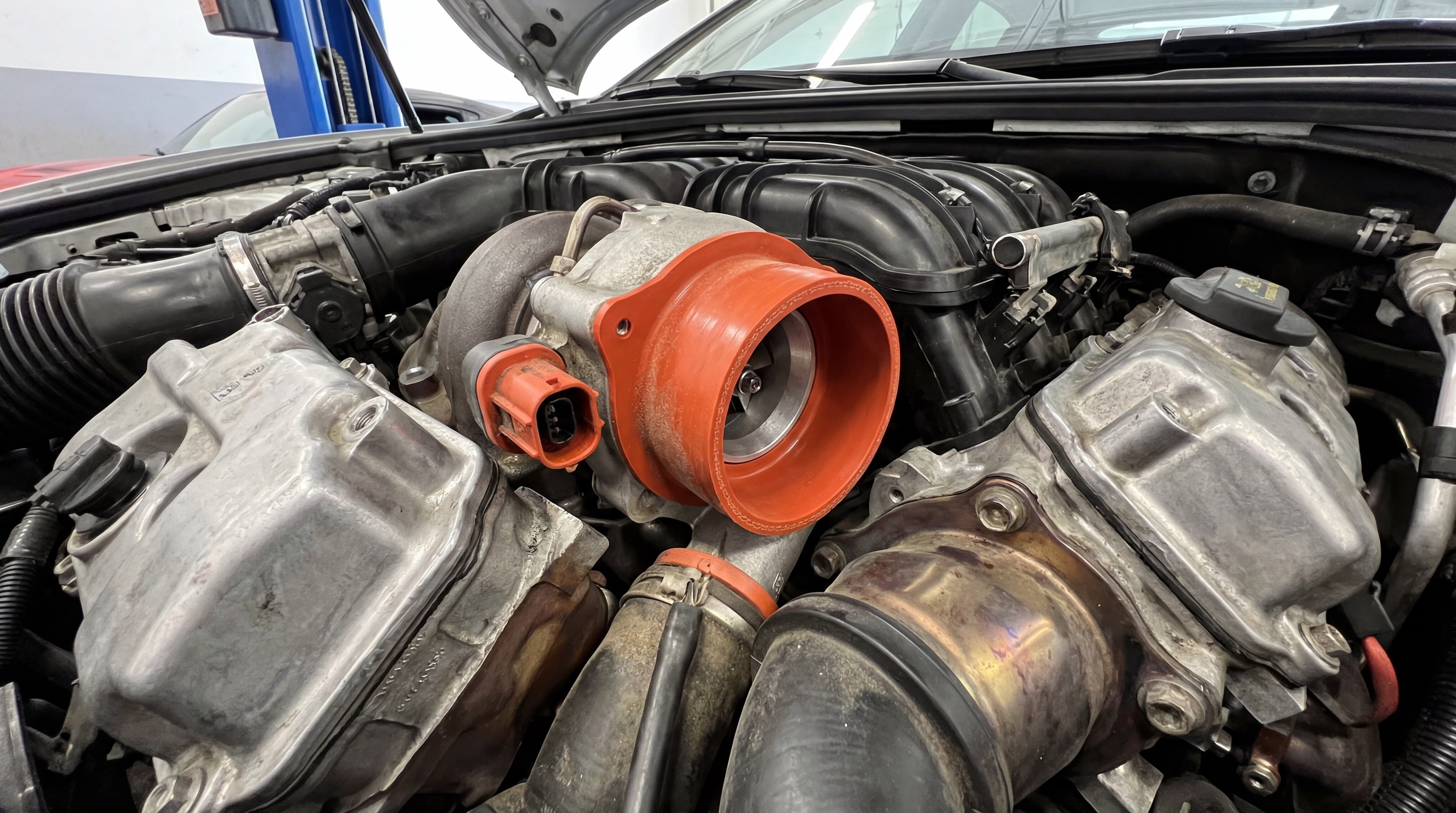 Automotive engine bay featuring high-temperature LSR gaskets