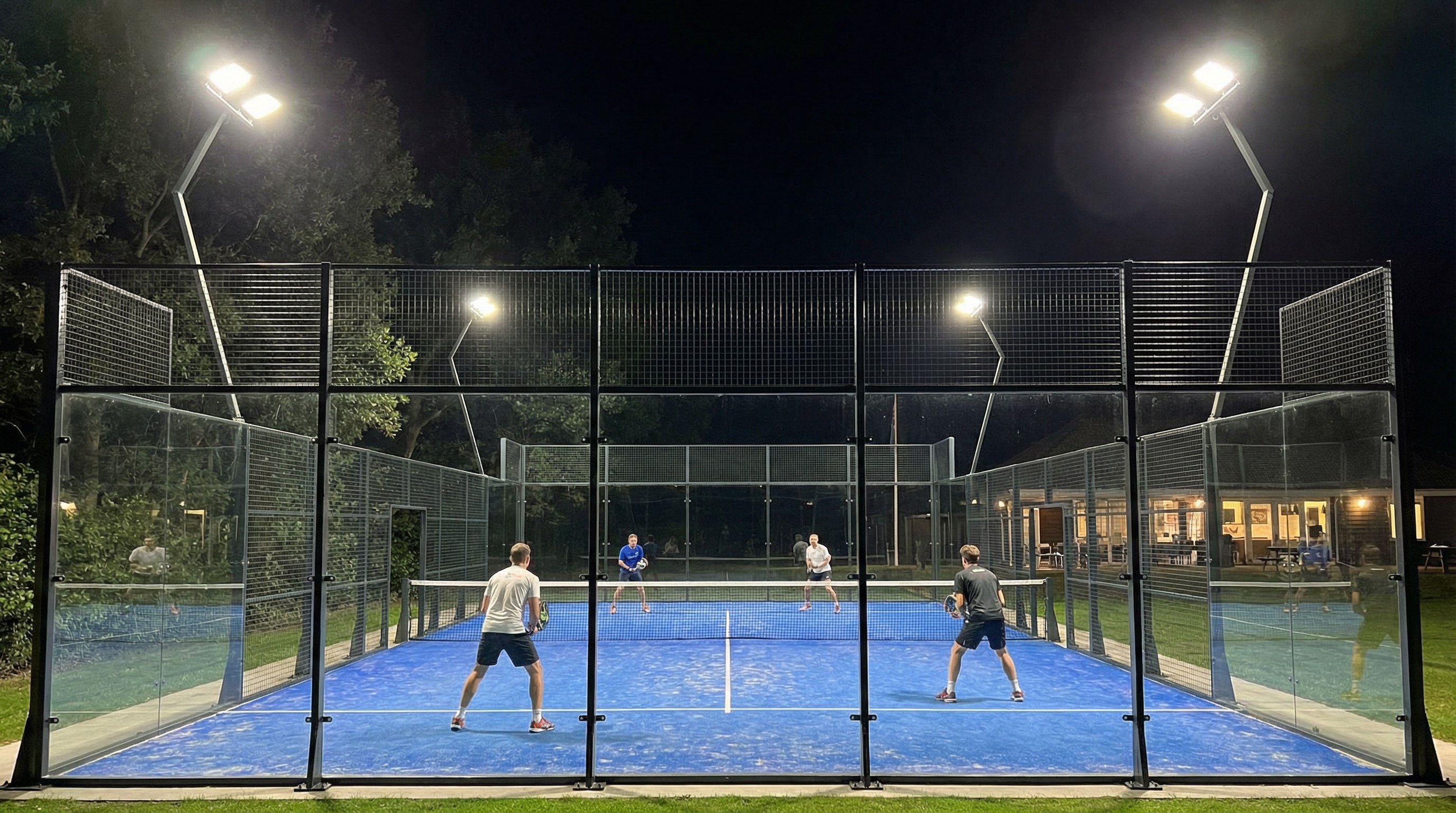 A night-time shot of a Padel club with Padel LED Lighting floodlights, showing uniform light distribution without shadows.