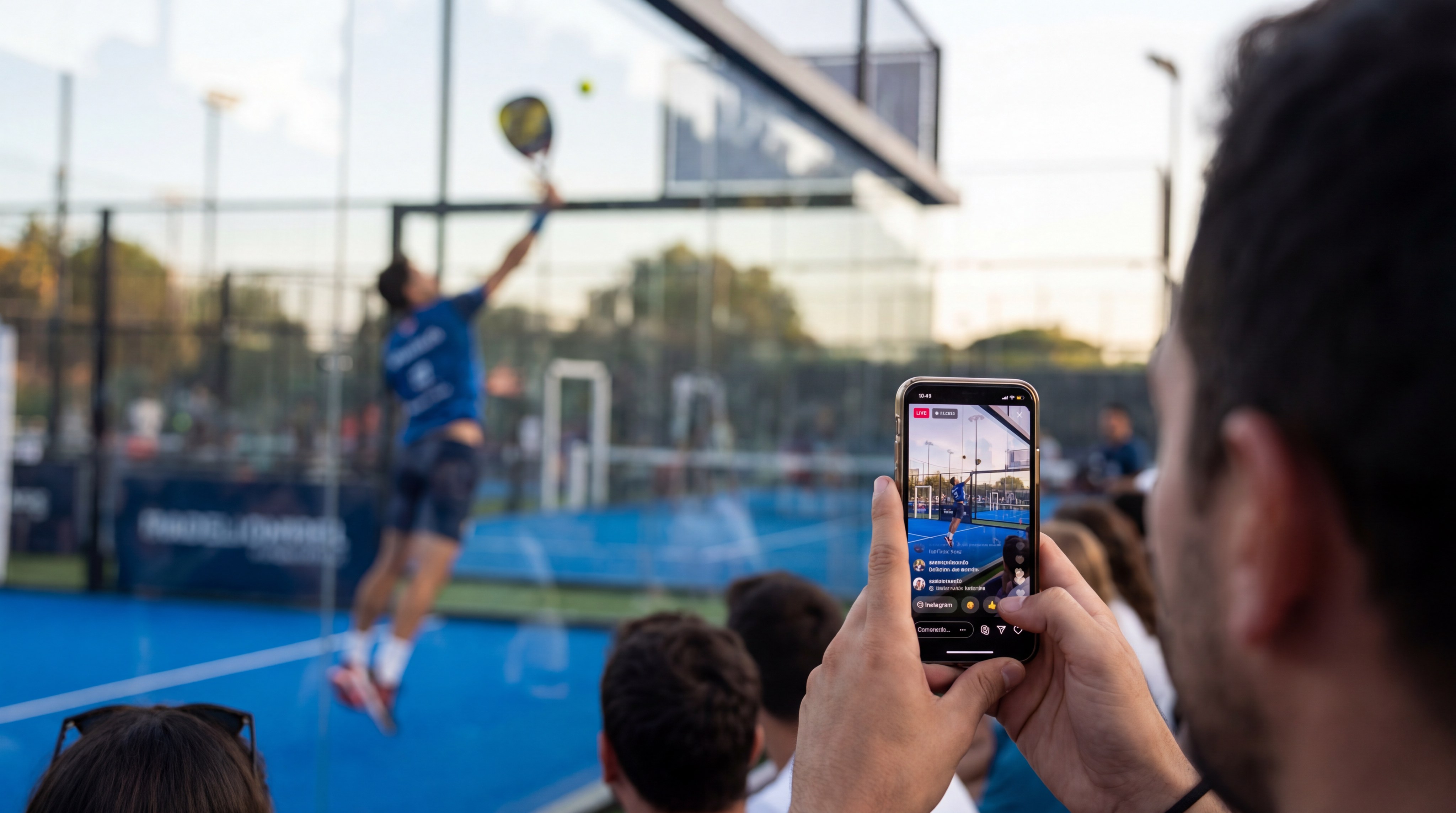 A mobile phone held in a hand, displaying a viral, high-quality video of a professional padel point.