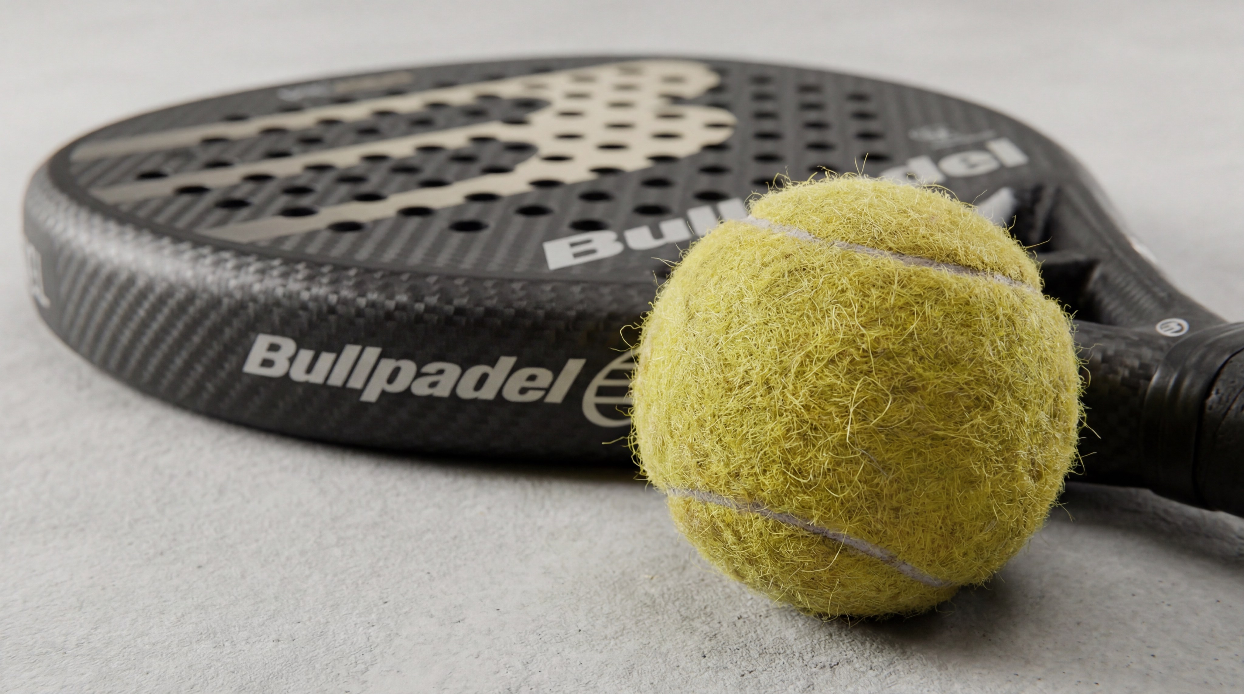 padel ball racket macro shot